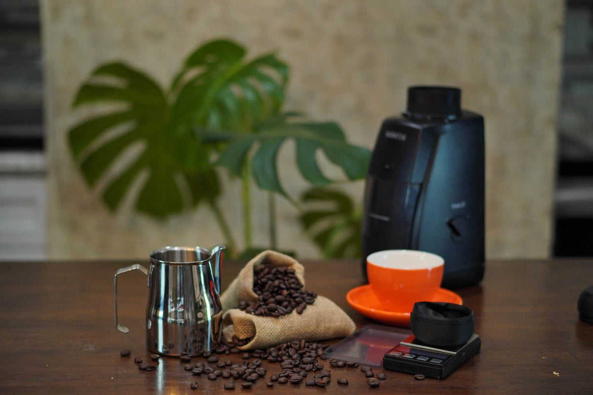 Coffee tools and accessories arranged on a home espresso bar
